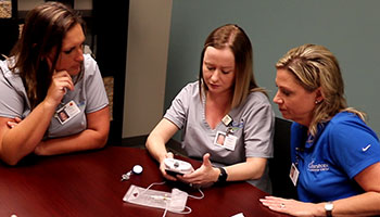 Nurses training with CADD pump