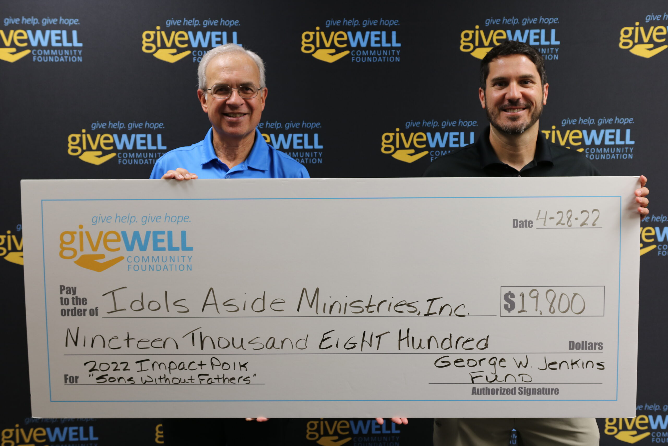 Photo of check presentation to Idols Aside Ministries