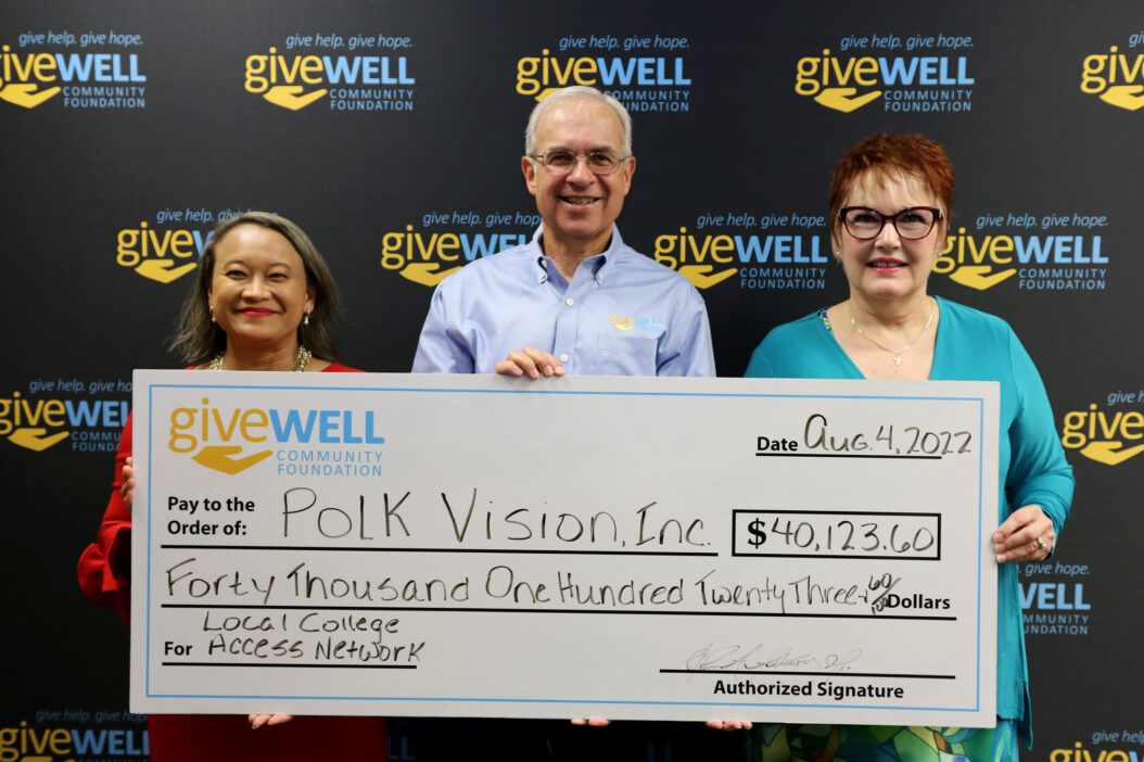 Check presentation photo with representatives from the community foundation and Polk Vision